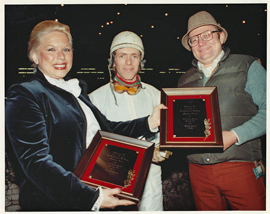 Mike Smith receives 1981 leading trainer award, Irwin Driedger receives leading jockey award, from Adrienne Gobuty.