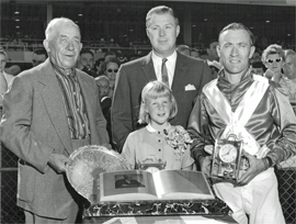 1960 Speer's Handicap presentation ceremony. (L to R) E. Johanson, Scotty Kennedy, Gene Pederson. Scotty's daughter Joan in front.