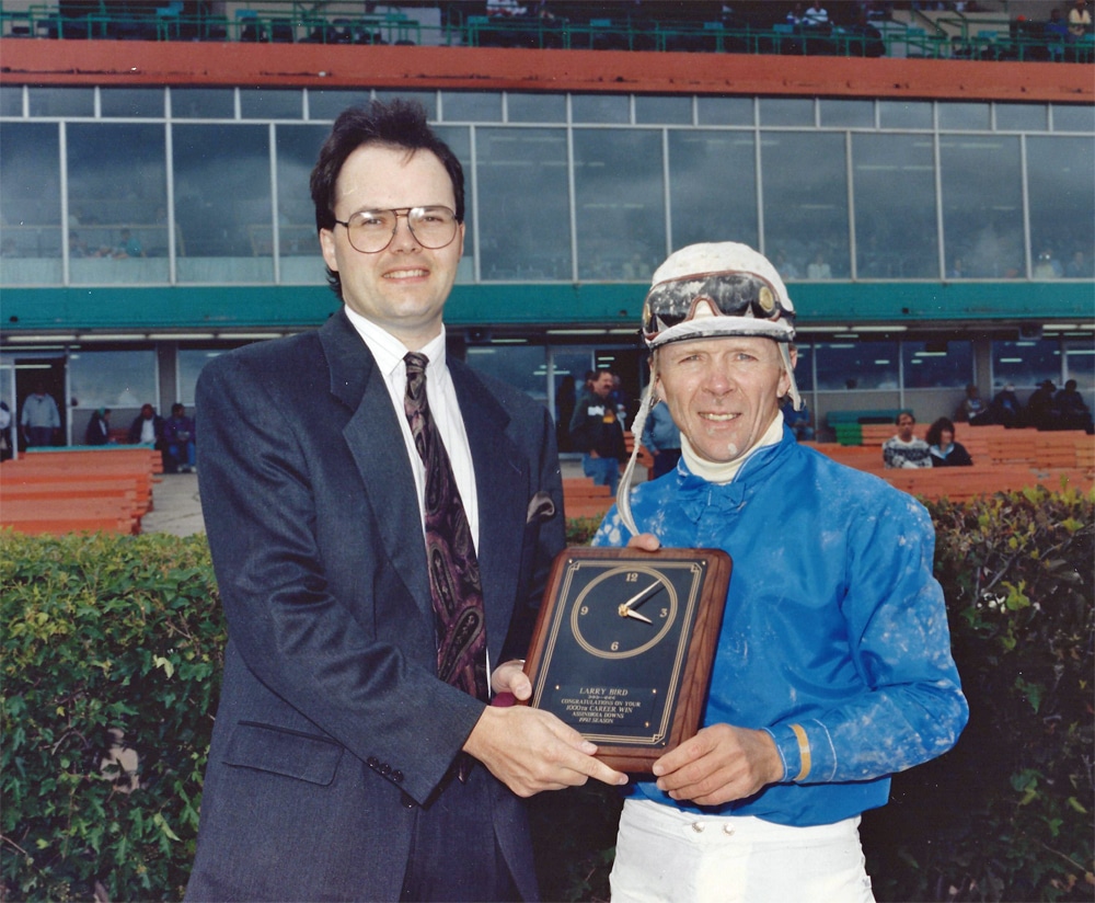 Darrell Stephansson presents Larry Bird with plaque for his 1,000th winner at Assiniboia Downs.