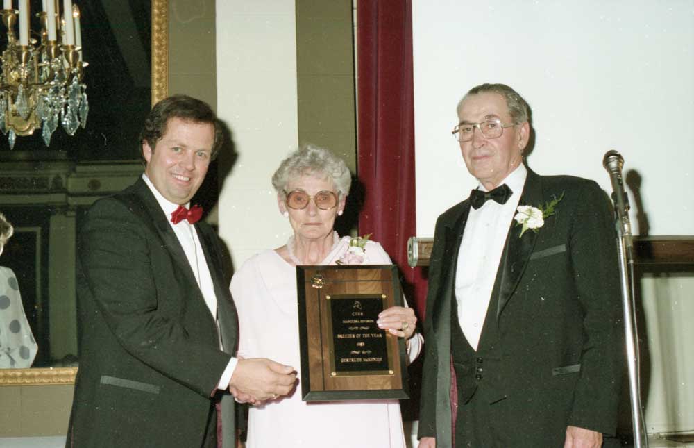 Bob Crockett (left) makes a presentation at the CTHS Awards Banquet in the 1980s.